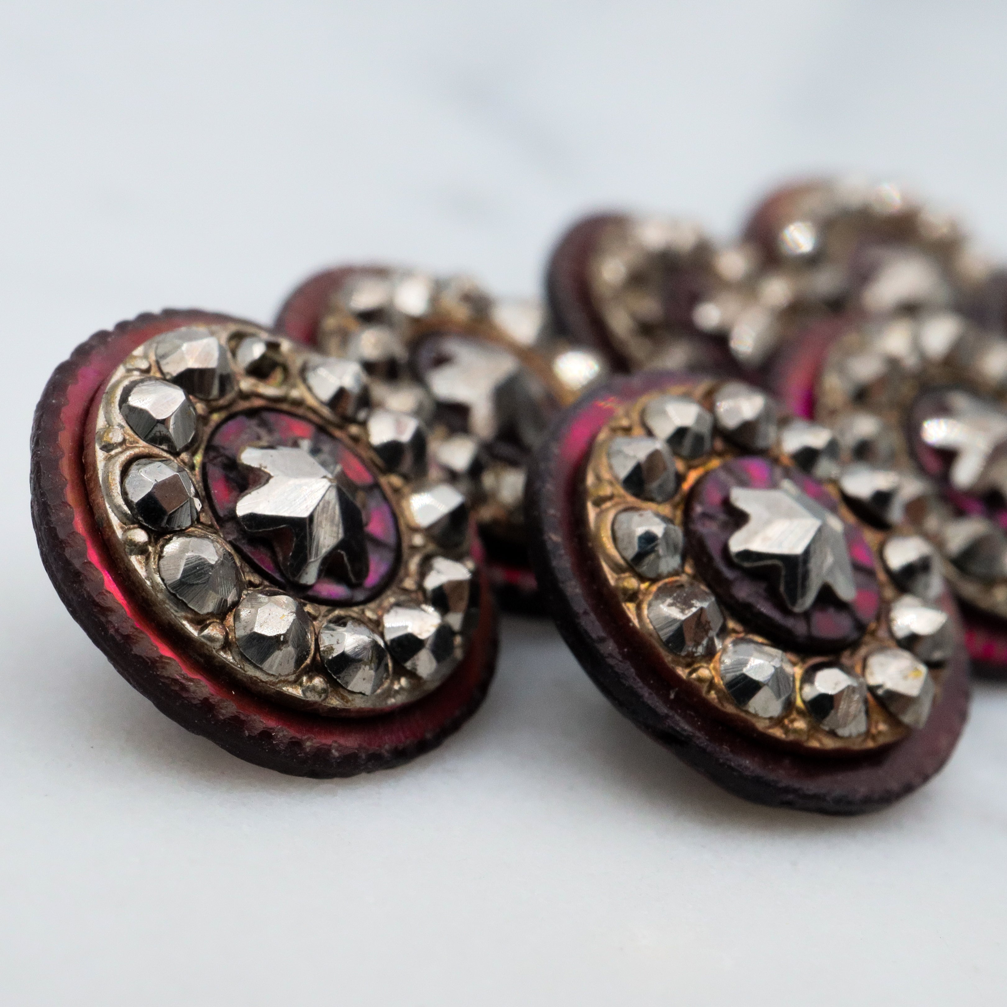 Set of 7 Antique Victorian purple shell cut steel rivet buttons